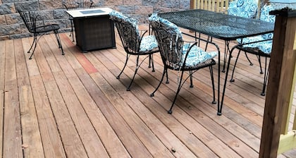 Beautiful cabin situated on wooded land with nice yard clearing and small stream