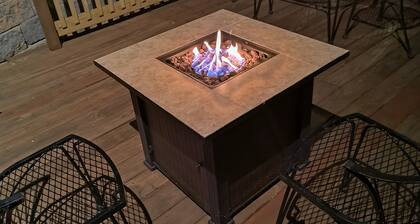 Beautiful cabin situated on wooded land with nice yard clearing and small stream