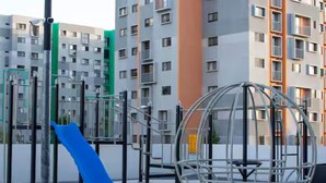 A playground with slides and climbing structures, surrounded by modern apartment buildings. - Parques Guadalajara Department Condominium, Central, Comfortable (Guadalajara)