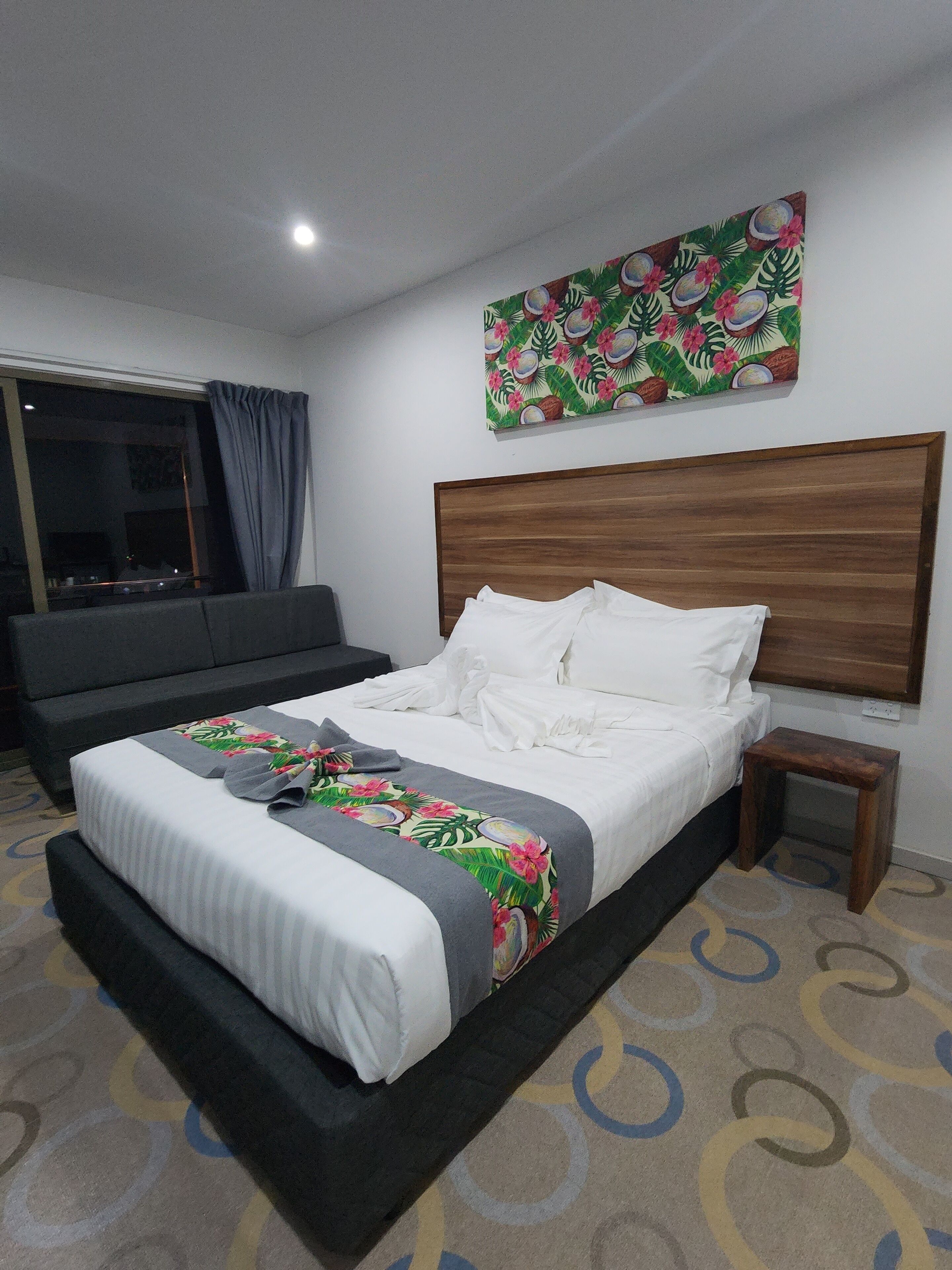 laptop workspace, blackout curtains, iron/ironing board, bed sheets