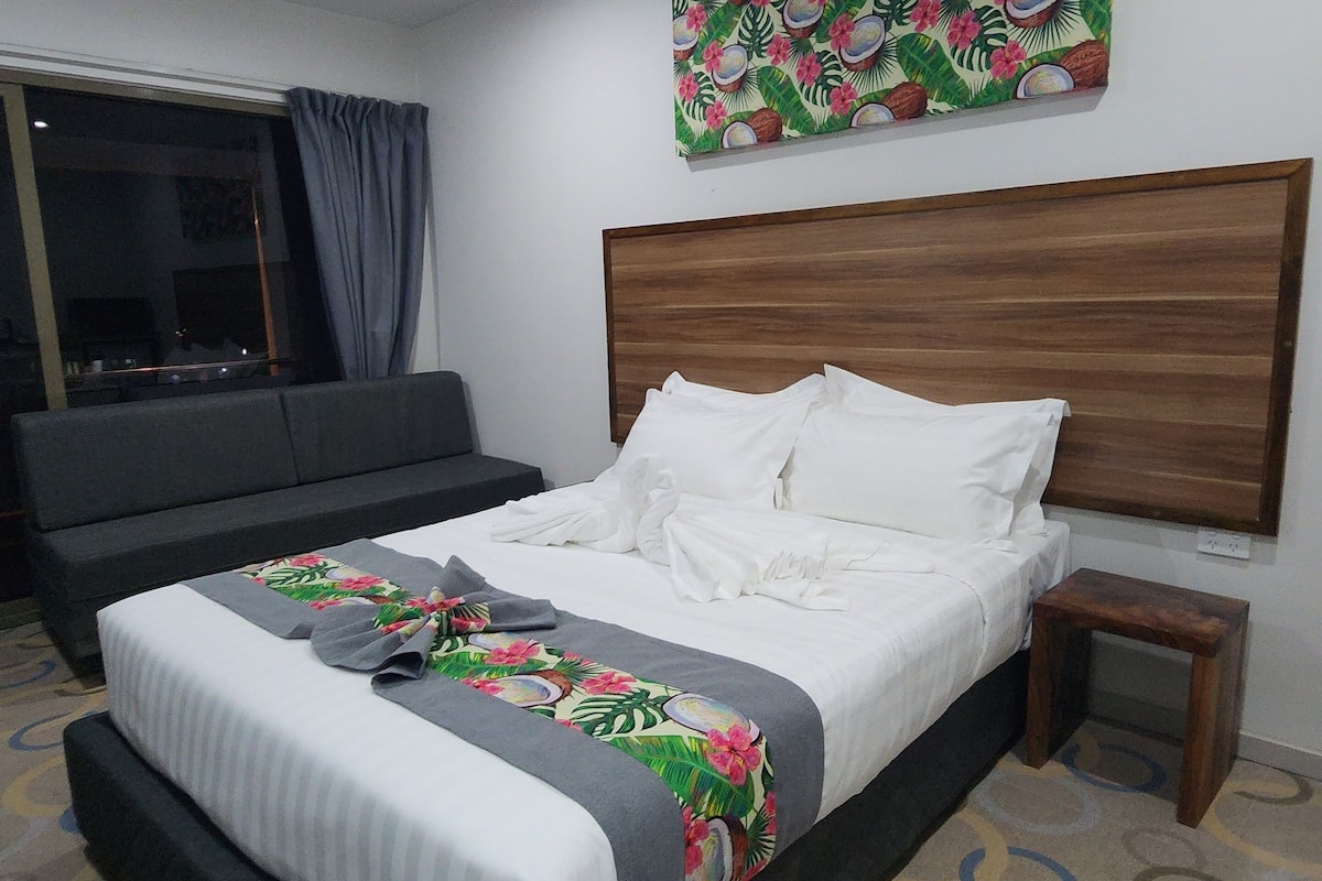 laptop workspace, blackout curtains, iron/ironing board, bed sheets