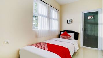 Habitación individual estándar | Espacio para trabajar con laptop, wifi gratis y ropa de cama