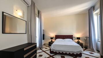 2 bedrooms, desk, blackout drapes, iron/ironing board