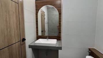 Shower, rainfall showerhead, towels, soap