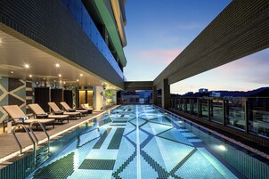 Outdoor pool, open 7:00 AM to 9:00 PM, pool umbrellas, sun loungers