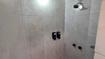 Economy Quadruple Room | Bathroom | Soap, shampoo, toilet paper