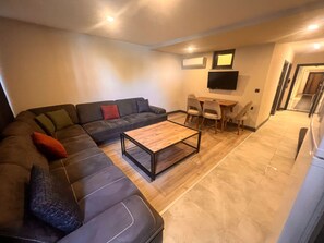 Family Apartment | Living area | 42-inch LED TV with satellite channels - Hayal Fener (Antalya)