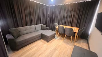 Family Apartment | Living area | 42-inch LED TV with satellite channels