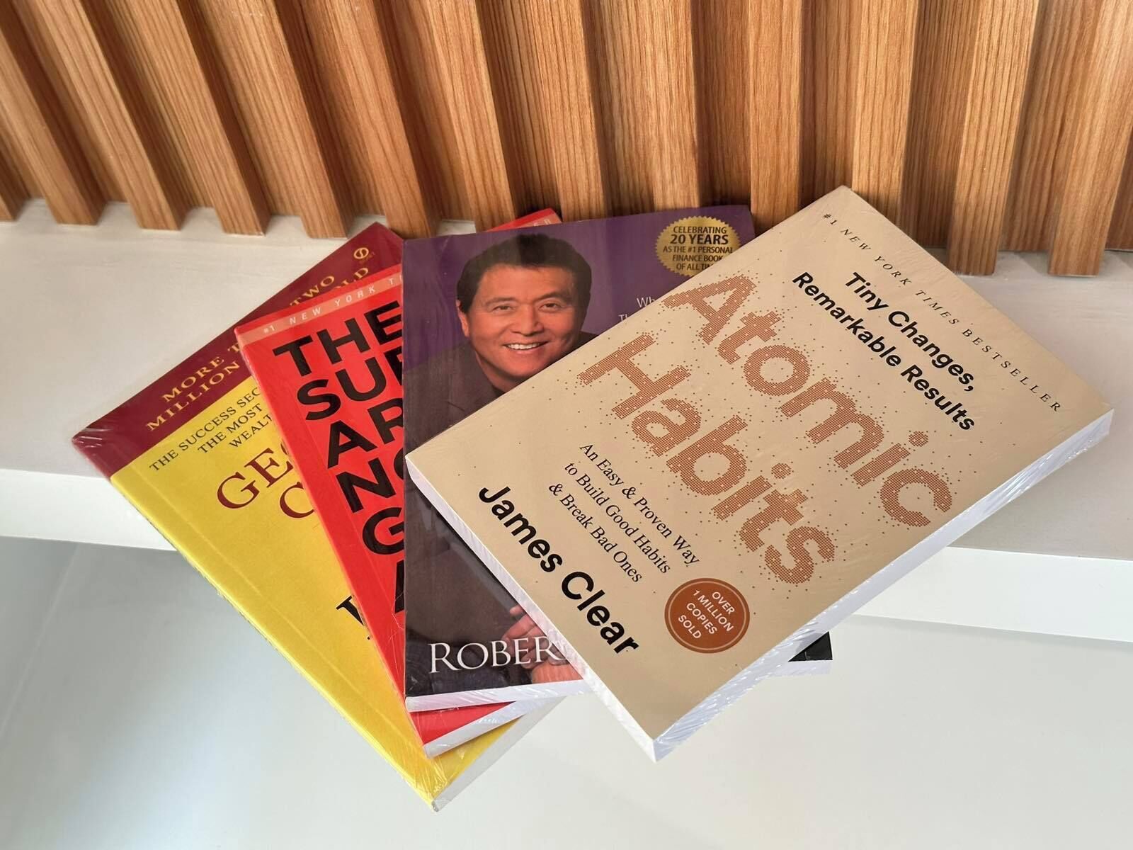 A collection of books on a shelf.