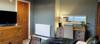 Mew Stone - A large double room with extensive views out to sea.