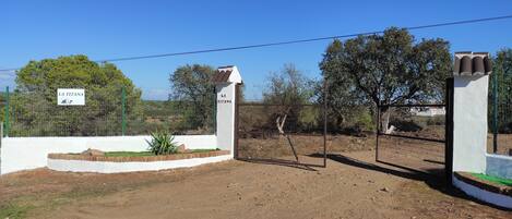 A fenced property with a sign reading "LA TITANA".