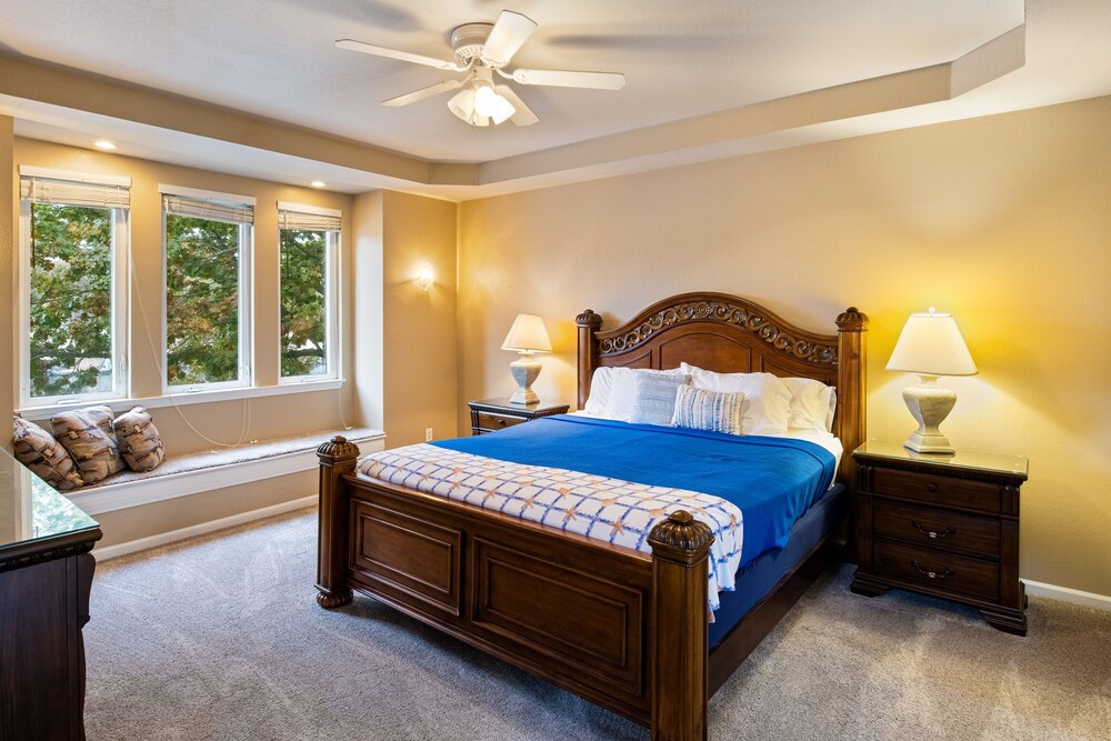 Exquisite lakefront home with game room, dock, balcony, central AC, & W