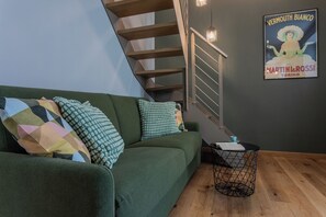 Family Apartment | Living area | 35-inch flat-screen TV with digital channels - Le Casette del Balon by Wonderful Italy (Turin)