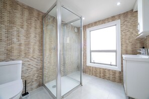 Shower, hair dryer, towels, soap