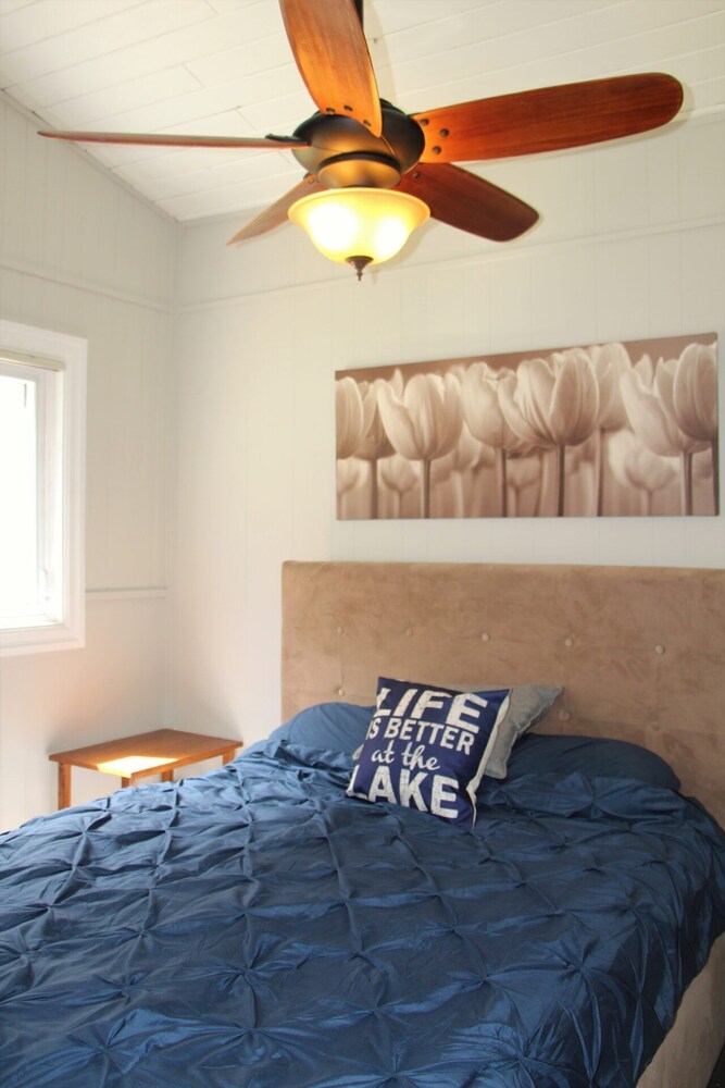 Modern log cabin with wrap around deck on Little Kennisis Dysart et