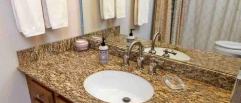 Hair dryer, towels, soap, toilet paper
