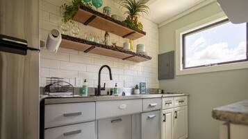 Fridge, microwave, stovetop, coffee/tea maker