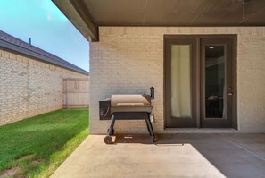 Enjoy al fresco dining with a barbecue grill and convenient access to the adjacent building.