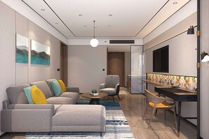 Suite Deluxe, 1 cama King size | Área de sala de estar | Televisión LCD de 55 pulgadas con canales por cable 