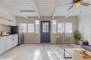Relax in this inviting space with a kitchen, dining area, and comfortable seating.