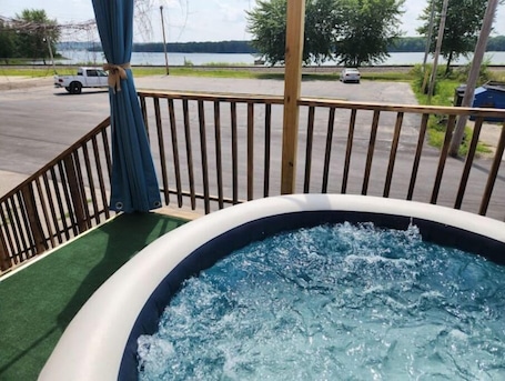 Outdoor spa tub. RiverView Lux: 420 Friendly Damage Control, private deck w/ hot tub