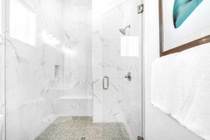 Shower, towels, soap, toilet paper