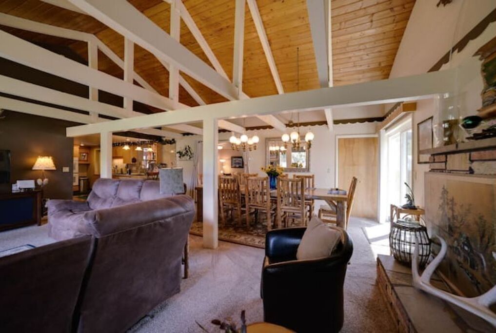 Living room with video of dining area