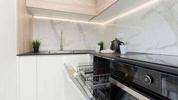 Apartment, 1 Bedroom, Balcony | Private kitchen | Fridge, oven, stovetop, dishwasher