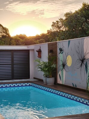 Outdoor pool, open 8:00 AM to 9:30 PM, pool loungers