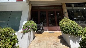 A multi-story building with a ground-level entrance, a visible FNB bank sign, and a visible Bay window. - New Jdeideh, Including Generator, Furnished Apartment, Parking, Great Location (Jdeideh)