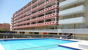 A multi-story hotel with a swimming pool. - Super Nice Apartment for 5 Guests With Pool and AC by Beahost Rentals (Caorle)