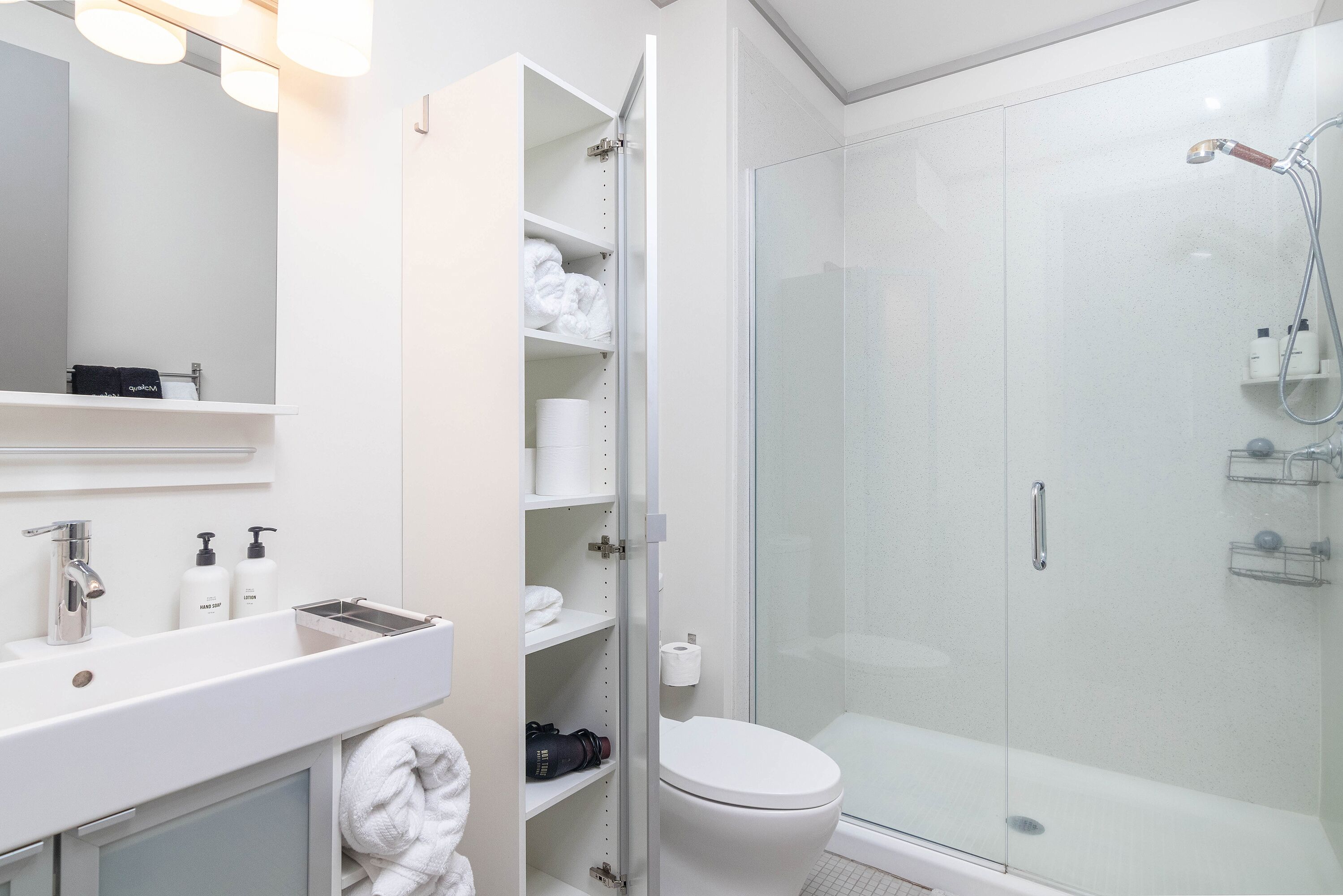 Hair dryer, towels, soap, toilet paper