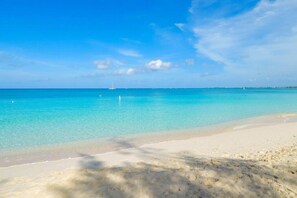 On the beach, sun loungers - In-Between Ritz Carlton and Westin | Oceanview 1BR on Seven Mile Beach (West Bay)
