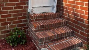 A white door with a glass panel, a brick exterior, and a 'WELCOME' sign. - Peaceful Private home near VSU, Down town & SGMC (Valdosta)