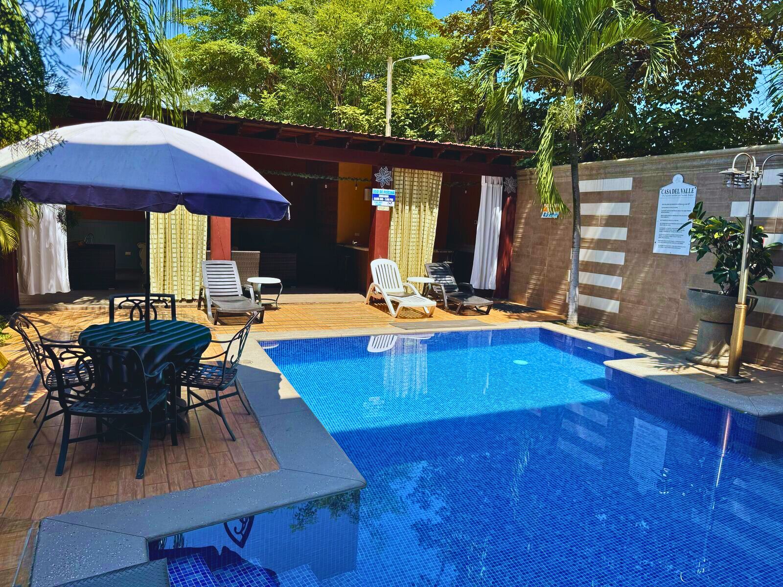 2 outdoor pools, open 8:00 AM to 7:00 PM, pool umbrellas
