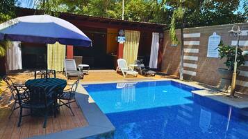 2 outdoor pools, open 8:00 AM to 7:00 PM, pool umbrellas