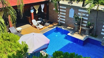 2 outdoor pools, open 8:00 AM to 7:00 PM, pool umbrellas