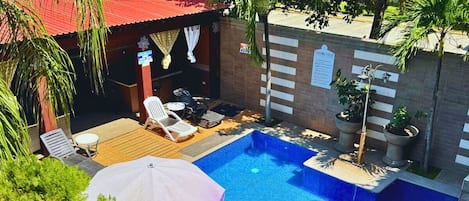 2 outdoor pools, open 8:00 AM to 7:00 PM, pool umbrellas