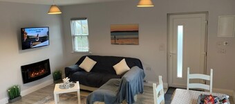 Tadgh's Cottage 
Near the Cliffs and Beaches 