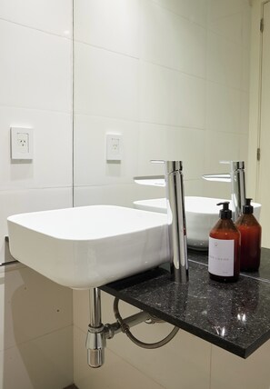 Hair dryer, towels, soap, shampoo