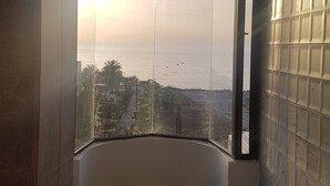 A room with a curved view window, a tiled wall, and a ceiling with recessed lighting. - Chalet In Solemar, Generator is Included, Parking, Wifi (Jounieh)