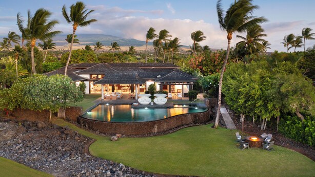 A luxurious house with a swimming pool, outdoor seating, and a view of the surrounding landscape. - Unmatched location Four Seasons Hualalai  5BR/5BA Ocean Estate 6500sqft 3/4 acre (Kailua-Kona)