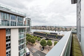 Hotel offers a rooftop terrace with seating and river views.
