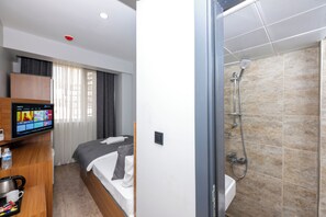 City Single Room | Bathroom | Combined shower/tub, designer toiletries, hair dryer, slippers