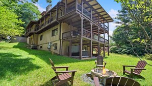 A large wooden cabin with a spacious deck and outdoor seating area. - Walk to Downtown Banner Elk | Hot Tub, Movie Room & Game Room | Sleeps 17 (Banner Elk)