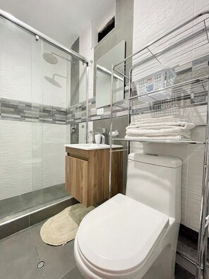 Shower, hair dryer, towels, soap