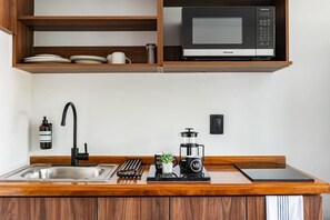 Fridge, microwave, stovetop, coffee/tea maker