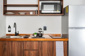 Fridge, microwave, stovetop, coffee/tea maker