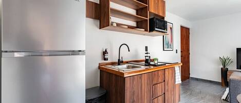 Fridge, microwave, stovetop, coffee/tea maker