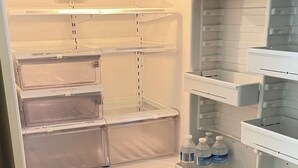 An empty refrigerator with multiple shelves and a freezer compartment. - Beautiful 3br, 1.5 bath townhouse centrally located in the heart of Milwaukee. (Milwaukee)